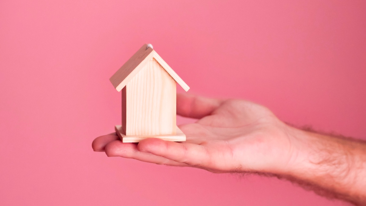hand-holding-miniature-house-pexels.jpg